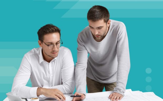 Two men reviewing project plans at a table with a teal background