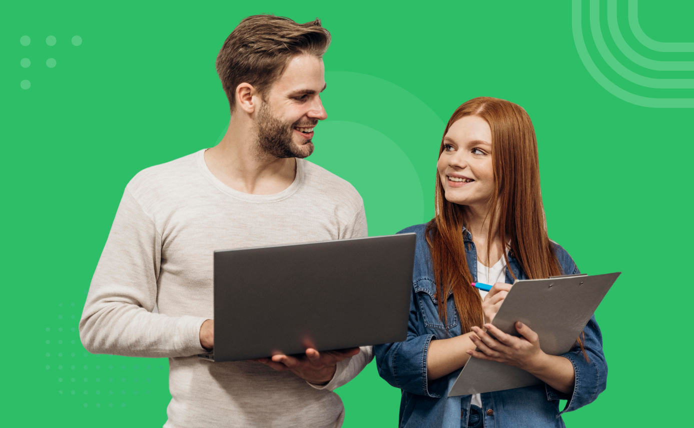 Man holding laptop and woman with clipboard smiling at each other on a green background.